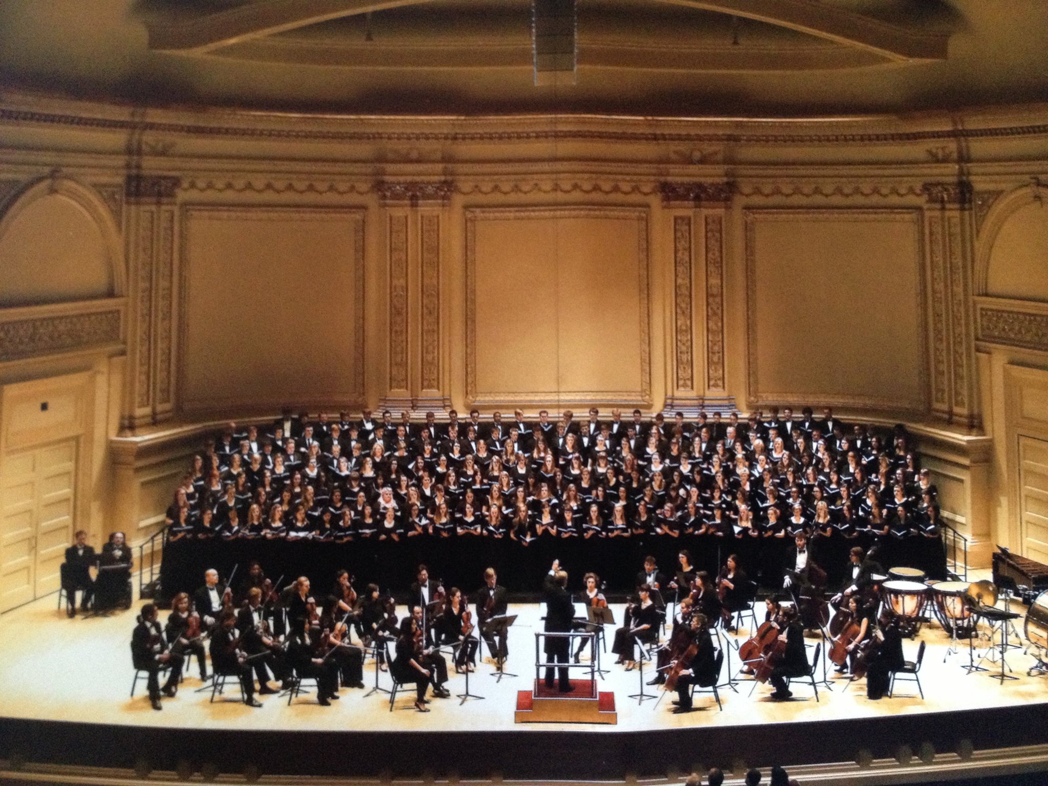 Large choir and orchestra inside Carnegie Hall